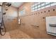 Accessible walk-in shower with dual shower heads and grab bars for added convenience at 4049 Nostalgia Ter, The Villages, FL 32163