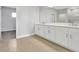 Bright bathroom showcasing a double sink vanity and tiled floors at 6208 Trailblaze Bnd, St Cloud, FL 34771