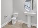 Powder room featuring a modern vanity and toilet at 6208 Trailblaze Bnd, St Cloud, FL 34771