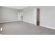 Spacious bedroom with neutral carpet and multiple doorways at 6208 Trailblaze Bnd, St Cloud, FL 34771