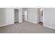 Spacious bedroom with neutral carpeting, ensuite bath and a large closet at 6208 Trailblaze Bnd, St Cloud, FL 34771