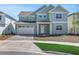 Charming two-story home with a brick driveway, attached two-car garage, and neatly landscaped front yard at 6208 Trailblaze Bnd, St Cloud, FL 34771