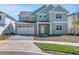 Charming two-story home with a two-car garage and well-manicured lawn at 6208 Trailblaze Bnd, St Cloud, FL 34771