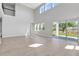 Open-concept living room featuring hardwood floors and sliding door to patio at 6208 Trailblaze Bnd, St Cloud, FL 34771