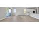 Bright living room features an open concept floorplan with sliding glass doors to outdoor area at 6208 Trailblaze Bnd, St Cloud, FL 34771