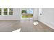 Bright living room features sliding glass doors with backyard and water views at 6208 Trailblaze Bnd, St Cloud, FL 34771