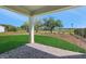 Covered patio view overlooking the backyard with lake view at 6208 Trailblaze Bnd, St Cloud, FL 34771