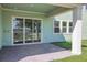 Covered patio with brick pavers and sliding glass doors to the backyard at 6208 Trailblaze Bnd, St Cloud, FL 34771