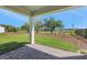 Covered patio with brick pavers and a serene view of the lawn and green spaces at 6208 Trailblaze Bnd, St Cloud, FL 34771