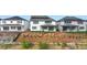 Exterior of the house with solar panels, grassy yard, and landscaping at 6608 Quest St, St Cloud, FL 34771