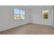 Bedroom featuring hardwood floors and a pair of windows that provides natural lighting at 6608 Quest St, Saint Cloud, FL 34771