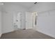 Bedroom featuring connecting doors and a closet with wire shelving at 6608 Quest St, Saint Cloud, FL 34771