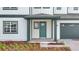 The front entrance features a covered porch, painted door, brick pathway, and manicured landscaping at 6608 Quest St, St Cloud, FL 34771