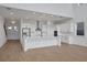 Bright, open-concept kitchen featuring stainless steel appliances, island and pendant lighting at 6608 Quest St, St Cloud, FL 34771