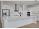 A well-lit kitchen with a spacious island, sleek appliances, and modern finishes at 6608 Quest St, St Cloud, FL 34771