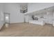 Bright and spacious living area open to modern kitchen and view of the upper floor at 6608 Quest St, St Cloud, FL 34771