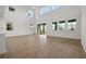 Spacious living room boasting high ceilings and an abundance of natural light from large windows at 6608 Quest St, St Cloud, FL 34771