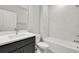 Bright bathroom featuring a sleek vanity with modern fixtures and a shower over tub with white subway tile at 6612 Quest St, St Cloud, FL 34771