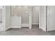 Bathroom featuring neutral tile floors, glass enclosed shower, and brushed nickel hardware at 6612 Quest St, St Cloud, FL 34771