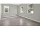 Bedroom featuring neutral tile floors and windows at 6612 Quest St, St Cloud, FL 34771
