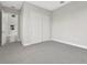 Bedroom featuring neutral carpet, neutral walls, and closet at 6612 Quest St, St Cloud, FL 34771