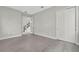 Open living area with tiled floors, double door entry, and natural light at 6612 Quest St, St Cloud, FL 34771