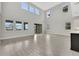 Spacious living area with high ceilings, large windows, and modern finishes throughout at 6612 Quest St, St Cloud, FL 34771