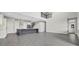 Open-concept space showcasing the kitchen, living, and dining areas with modern tile floors at 6612 Quest St, St Cloud, FL 34771