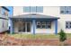 Relaxing covered patio with blue trim, views to the fenced yard, perfect for outdoor entertaining at 6612 Quest St, St Cloud, FL 34771
