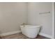 Relaxing bathroom featuring a standalone tub and modern fixtures, creating a luxurious experience at 6616 Quest St, St Cloud, FL 34771