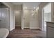 Contemporary bathroom featuring a tiled walk-in shower and wood-look tile flooring at 6616 Quest St, St Cloud, FL 34771