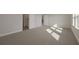 Spacious bedroom with plush carpet, natural light, and ample space for relaxation and personalization at 6616 Quest St, St Cloud, FL 34771