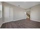 Versatile bonus room with hardwood floors, a closet, and french doors leading to a staircase; adaptable for any need at 6616 Quest St, St Cloud, FL 34771
