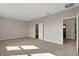 Large bedroom featuring plush carpet and access to an ensuite bathroom at 6616 Quest St, St Cloud, FL 34771