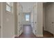 Bright entryway features wood-look tile flooring and French doors leading to the office at 6616 Quest St, St Cloud, FL 34771