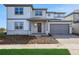 Beautiful two-story home with a well-manicured lawn and an attached two-car garage at 6616 Quest St, St Cloud, FL 34771
