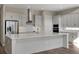 Bright, open kitchen featuring stainless steel appliances, a large central island, and sleek cabinetry at 6616 Quest St, St Cloud, FL 34771