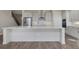 Spacious kitchen with large island, stainless steel appliances, and a tile backsplash, adjacent to a staircase at 6616 Quest St, St Cloud, FL 34771