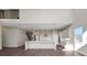 Spacious kitchen island, stainless steel appliances, and access to a living area and staircase at 6616 Quest St, St Cloud, FL 34771
