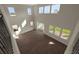 Open-concept living room featuring wood floors, high ceilings, and an abundance of natural light at 6616 Quest St, St Cloud, FL 34771