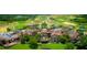 A beautiful aerial view of the neighborhood shows the luxurious villas and landscaped greenery at 15615 Vetta Dr, Montverde, FL 34756
