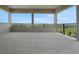 A spacious covered balcony provides amazing views of the lush green landscape at 15615 Vetta Dr, Montverde, FL 34756
