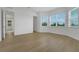 Large bedroom with plank flooring, windows, and a walk-in closet at 15615 Vetta Dr, Montverde, FL 34756