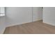 A bright bedroom with laminate flooring, white walls, and white trim at 15615 Vetta Dr, Montverde, FL 34756