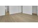 Spacious bedroom with plank flooring and white trim at 15615 Vetta Dr, Montverde, FL 34756