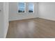 Spacious bedroom with lots of natural light and wood flooring at 15615 Vetta Dr, Montverde, FL 34756