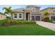 Charming two-story home featuring a tile roof and a two car garage at 15615 Vetta Dr, Montverde, FL 34756