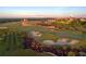 Expansive golf course with manicured greens and sand traps, complemented by picturesque views of the surrounding landscape at 15615 Vetta Dr, Montverde, FL 34756