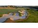 Stunning golf course with challenging sand traps and rolling green hills, perfect for golf enthusiasts and scenic views at 15615 Vetta Dr, Montverde, FL 34756