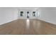 Bright open-concept living room with wood flooring and a balcony at 15615 Vetta Dr, Montverde, FL 34756